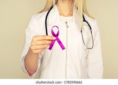 Female Doctor In White Uniform With Purple Awareness Of Ribbon In Hand For ADD,ADHD,Alzheimer Disease ,Arnold Chiari Malformation,Childhood Hemiplegia Stroke, Epilepsy, Chronic Acute Pain,Crohns 