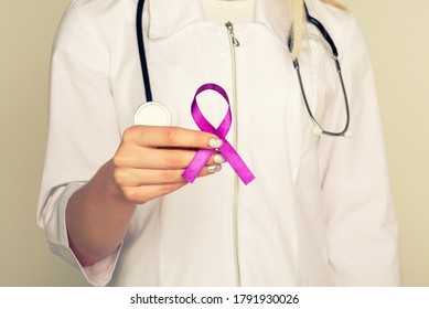 Female Doctor In White Uniform With Purple Awareness Of Ribbon In Hand For ADD,ADHD,Alzheimer Disease ,Arnold Chiari Malformation,Childhood Hemiplegia Stroke, Epilepsy, Chronic Acute Pain,Crohns 