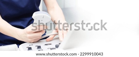 Female doctor woman in uniform sitting in office in a hospital with ultrasound diagnostic machine equipment and ready to examine patients and do ultrasound of heart, thyroid gland or abdominal cavity