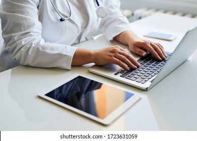 Female Doctor Working With Her Laptop  In Medical Office