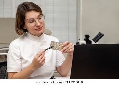 Female Doctor Working At Her Office Online Using Laptop. Telemedicine Concept. Primary Care Consultation Of The Patient By Video Call.Healthcare And Medicine Concept.