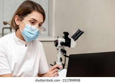 Female Doctor Working At Her Office Online Using Laptop. Telemedicine Concept. Primary Care Consultation Of The Patient By Video Call.Healthcare And Medicine Concept.