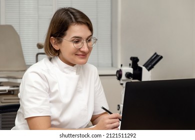 Female Doctor Working At Her Office Online Using Laptop. Telemedicine Concept. Primary Care Consultation Of The Patient By Video Call.Healthcare And Medicine Concept.