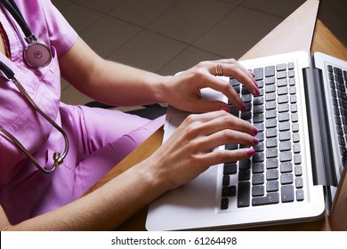 Female doctor working with laptop