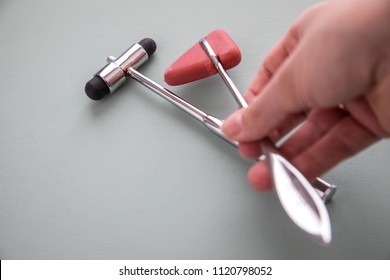 Female Doctor Working With Reflex Hammer