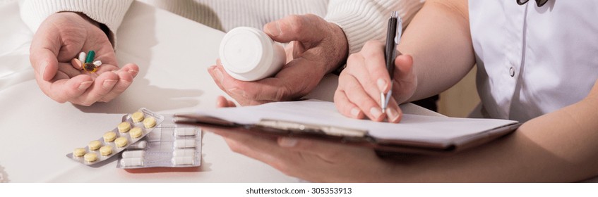 Female Doctor Is Writing A Prescription For Her Patient 