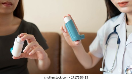 Female doctor/pharmacist teaching inhaler device technique to COPD or asthma patients. She explains how to use the medicine inhaler, indications and side effects. Health care and medical. Close up. - Powered by Shutterstock