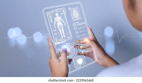 Female doctor's hand pokes at a medical icon harogram. medical concepts, treatment, medical technology, medical application - Shutterstock ID 2219561665