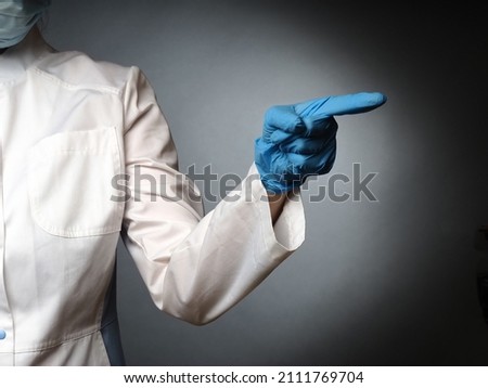 female doctor's hands in nitrile blue gloves show the test okay thumbs up