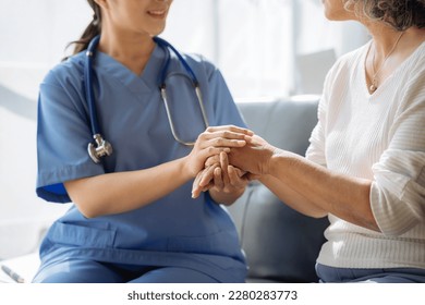 Female doctors shake hands with patients encouraging each other  To offer love, concern, and encouragement while checking the patient's health. concept of medicine. - Shutterstock ID 2280283773