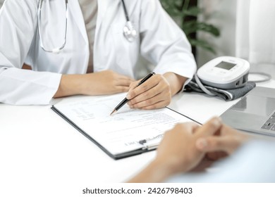 Female doctors who treat patients make an appointment to listen to the results after a physical examination explain medical information and diagnose the disease. Medical concepts and good health.