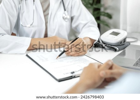 Female doctors who treat patients make an appointment to listen to the results after a physical examination explain medical information and diagnose the disease. Medical concepts and good health.