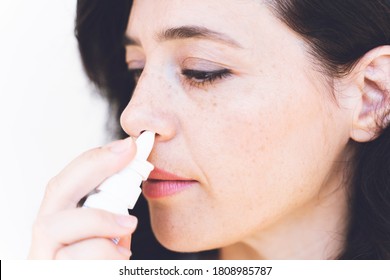 Female Doing Nasal Irrigation By Using Normal Saline Solutiona Spray