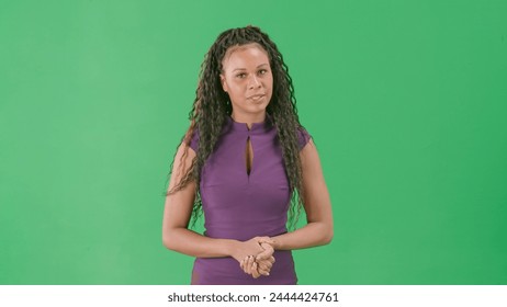 Female in dress isolated on chroma key green screen background. African american woman tv news host standing talking looking at camera. - Powered by Shutterstock