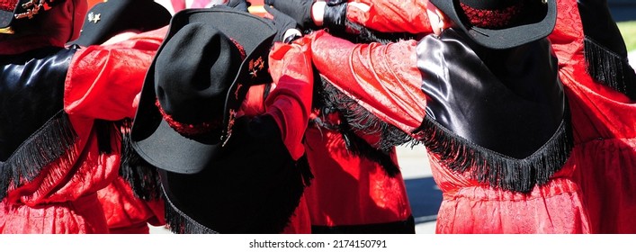 Female Drill Team Saying A Prayer Before Marching In A Parade Outside.