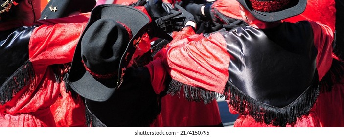 Female Drill Team Saying A Prayer Before Marching In A Parade Outside.