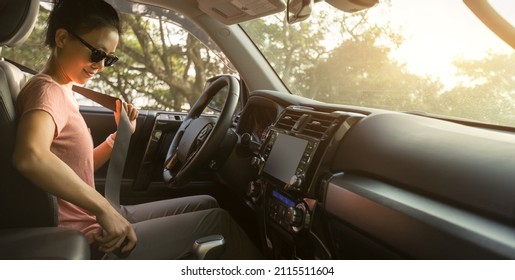 Female Driver Buckle Up The Seat Belt Before Driving Car