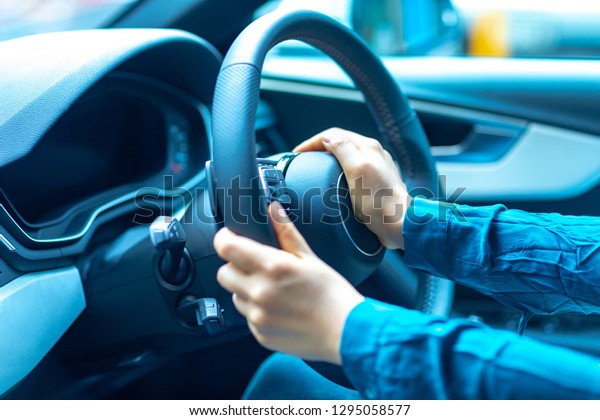 Female driver is driving a\
car