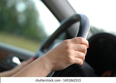 female driver is holding steering wheel - Shutterstock ID 1451862515