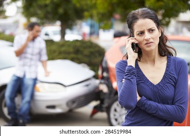 Female Driver Making Phone Call After Traffic Accident