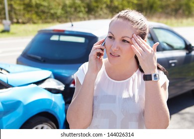 Female Driver Making Phone Calls After Traffic Accident