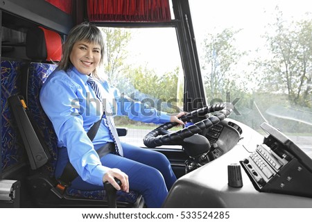 Female driver sitting in bus