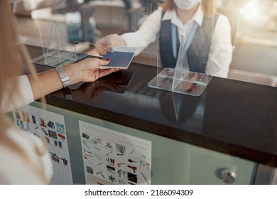 Female Employee Of Airport Checking Passports And Biometric Data