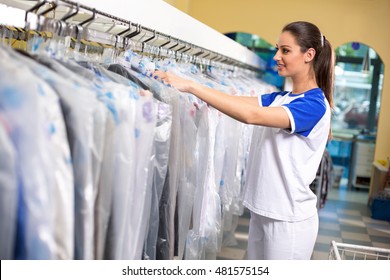 Female employees checks clothes in plastic bags