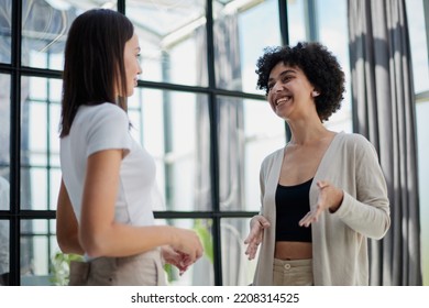 female employees enjoying break. Two women in formal clothes sitting in office lounge - Shutterstock ID 2208314525