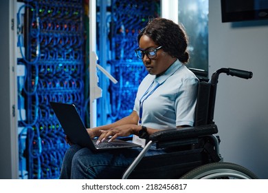 Female engineer with disability working in data center - Powered by Shutterstock