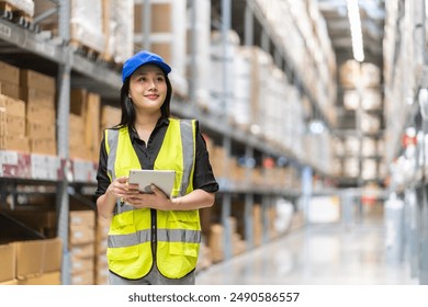 Female engineer is handling shipping and checking stock inventory in the warehouse with a tablet, industry, import-export, inventory management, logistics, global transportation at warehouse, business - Powered by Shutterstock