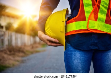 Female Engineer Holding Hardhat Safety Standing Outdoor Work Place 