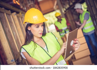 Female Engineer Holding Ipad At The Warehouse Store After The Factory Reopening From The Covid-19 Pandemic