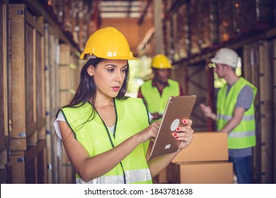 Female Engineer Holding Ipad At The Warehouse Store After The Factory Reopening From The Covid-19 Pandemic