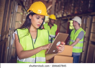 Female Engineer Holding Ipad At The Warehouse Store After The Factory Reopening From The Covid-19 Pandemic