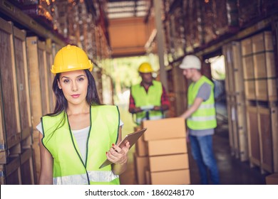 Female Engineer Holding Ipad At The Warehouse Store After The Factory Reopening From The Covid-19 Pandemic