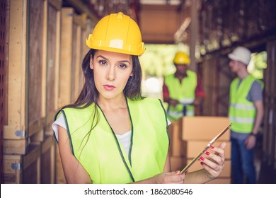 Female Engineer Holding Ipad At The Warehouse Store After The Factory Reopening From The Covid-19 Pandemic