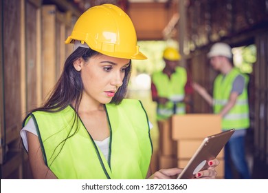 Female Engineer Holding Ipad At The Warehouse Store After The Factory Reopening From The Covid-19 Pandemic