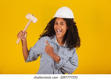 Female Engineer Holding A Sledgehammer