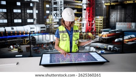 Female Engineer At Moon Exploration Program Rocket Construction Facility