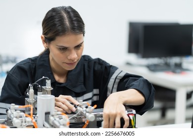 Female engineer training Programmable logic controller with AI robot training kit and mechatronics engineering in the laboratory room - Shutterstock ID 2256676005
