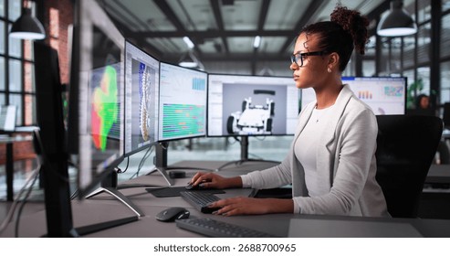 Female Engineer Using CAD Software To Design Mechanical Parts For Car