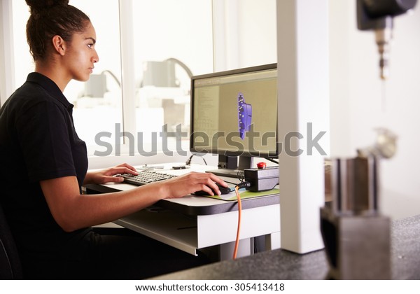 Female\
Engineer Using CAD System To Work On\
Component