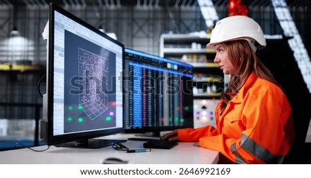 Female Engineer Using SCADA Control In Rocket Construction Industry Center. Woman Checking Data On Big Screen