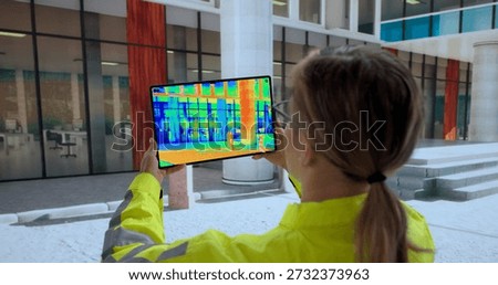 Female Engineer Using Thermal Camera To Make Energy Audit.