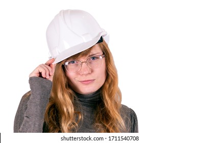Female Engineer In A White Hard Hat Close Up