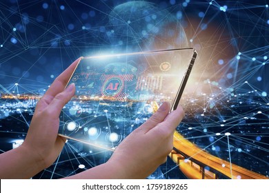 Female engineers using visual screen equipment,with intelligent program connect smart city,concept use devices and use artificial intelligence or AI to control via satellite and wireless networks.