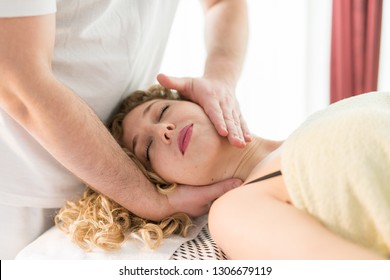 Female enjoying her massage done by a professional.