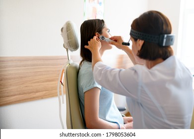 Female Ent Doctor And Patient In Office, Ear Exam