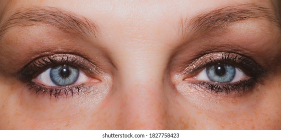 Female Eyes. Freckles Skin. Mascara On The Eyelashes. Iris Close Up